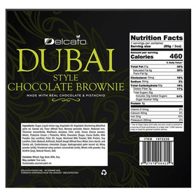 Delcato fudgy dark chocolate brownie with pistachio topping close-up showing texture.