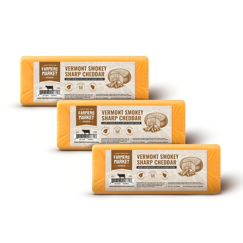 Deli Direct Smokey Sharp Cheddar wedge on board, ideal for entertaining.