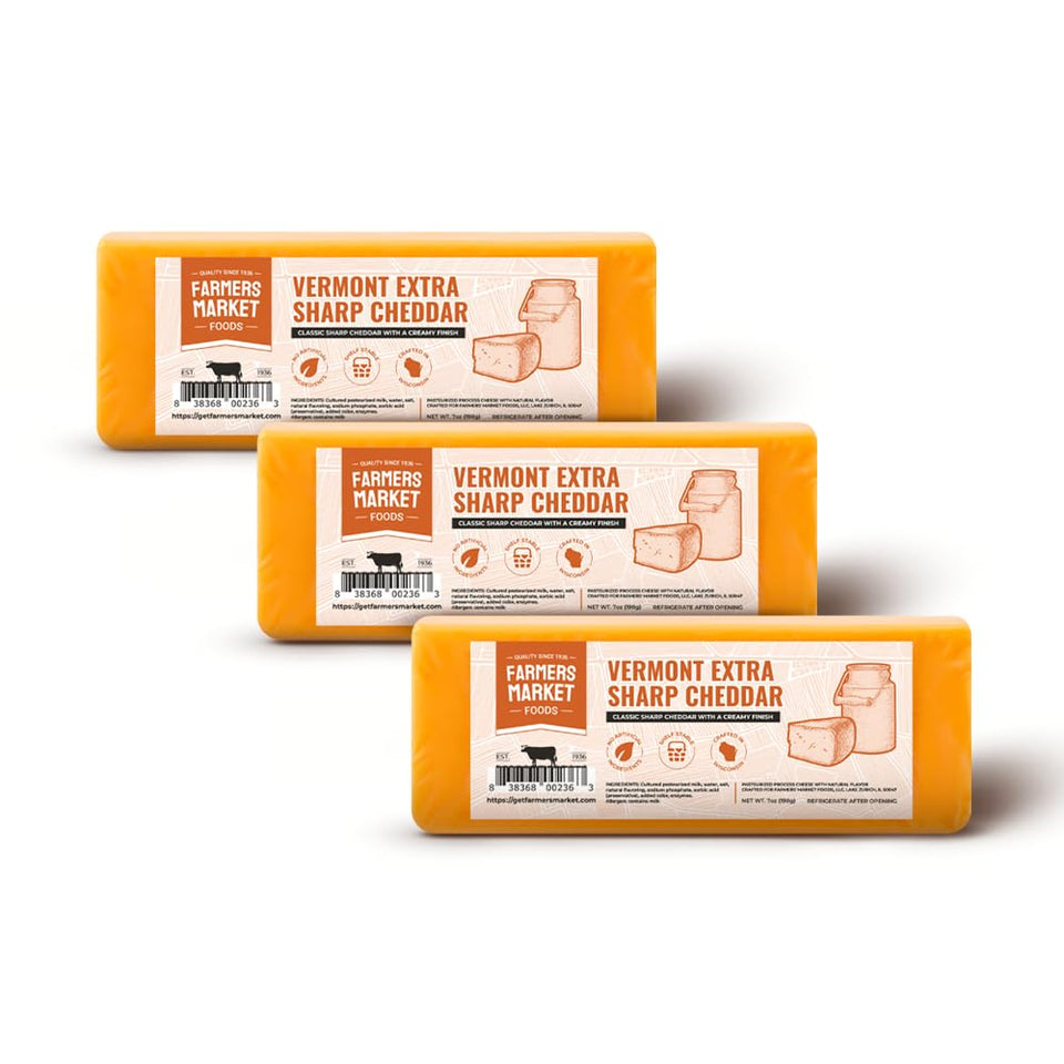 Deli Direct Wisconsin Extra Sharp Cheddar block on a cutting board ready for slicing.