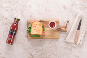 Den Nigris Excellence Ketchup bottle on a table ready to use.