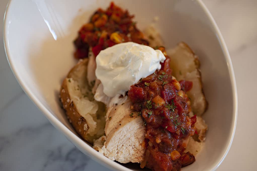 Dennis' salsa on a hero plate, dip-ready for tacos or eggs.