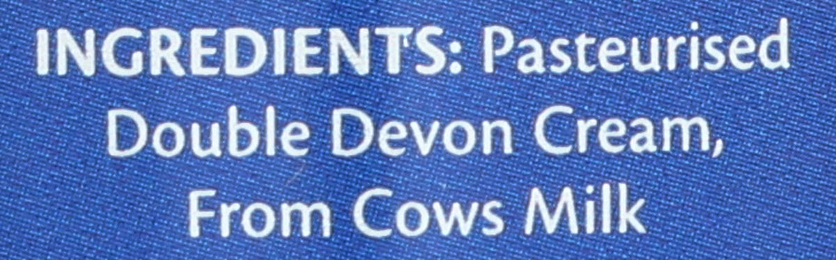 Devon Cream Company cream poured over berries for a luxurious dessert