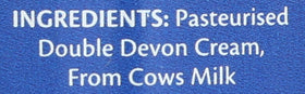 Devon Cream Company cream poured over berries for a luxurious dessert