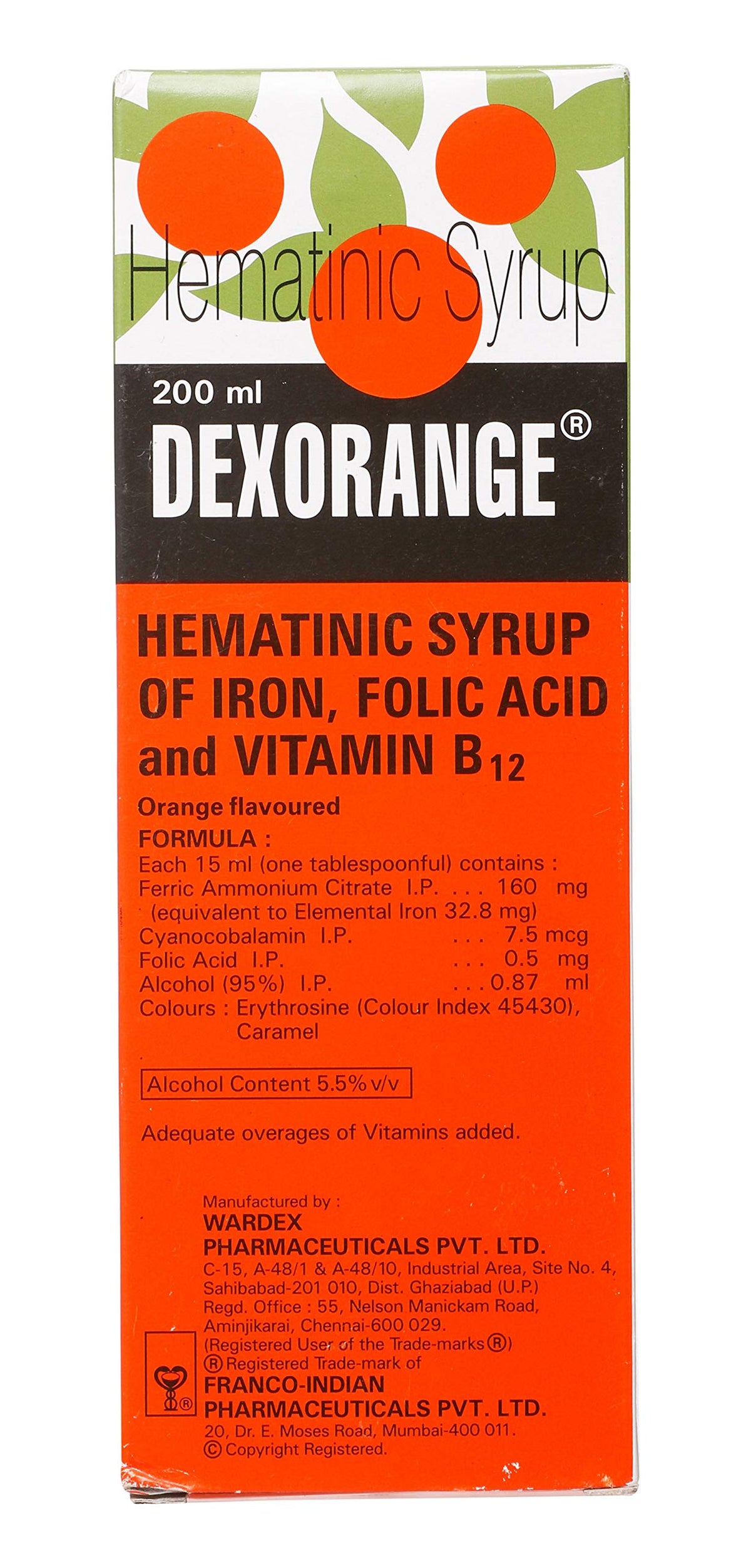 Pouring Dexorange Syrup with a measuring spoon for accurate dosage.