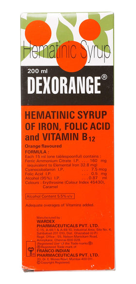 Pouring Dexorange Syrup with a measuring spoon for accurate dosage.