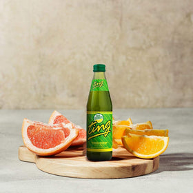 D&G Ting poured into a glass showing fizz and clarity