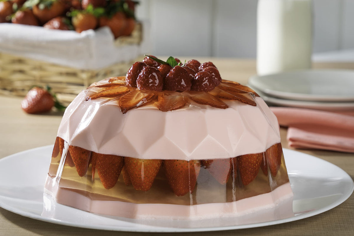 D'Gari strawberry gelatin milk mixing demonstrates creamy dessert prep.