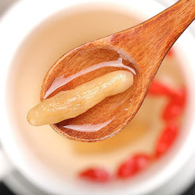 Tea in cup reveals aromatic, soothing infusion from Ophiopogon herb.