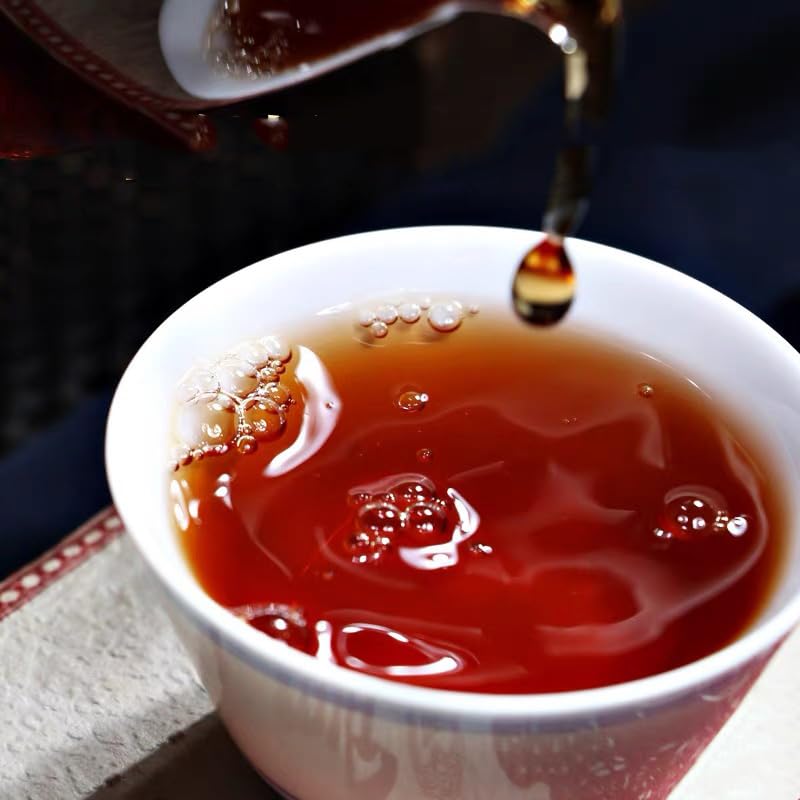 Dian Mai Hao energizing Pu-erh brew ready in cup.