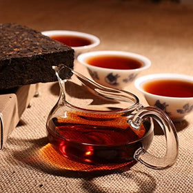 Dian Mai Hao ripe Pu-erh tea brick close-up shows rich aroma and smooth brew.