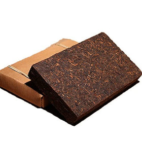 Dian Mai Hao tea cake compression detail suggests traditional craftsmanship.