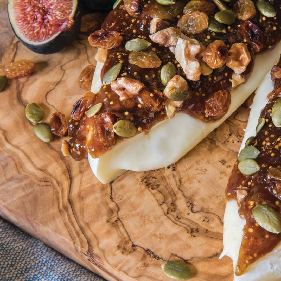 Divina fig spread on crostini with cheese for a savory bite.