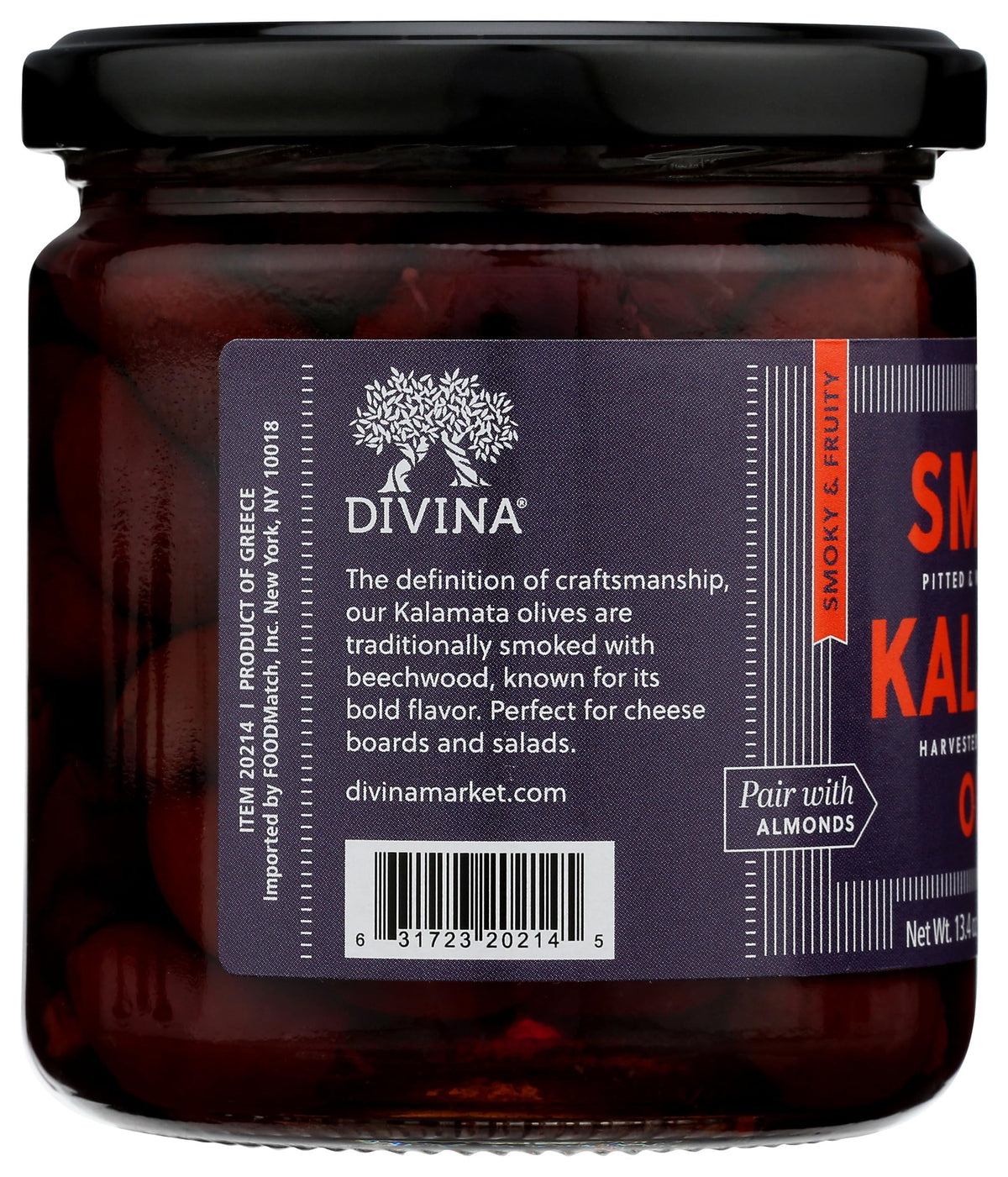 DIVINA smoked Kalamata olives on a grilled chicken salad for depth.