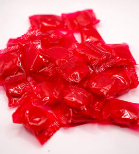 Closeup of DM Sweets Cinnamon Discs hard candy glossy surface