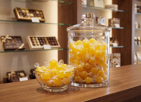 DM Sweets jumbo lemon candy balls golden-yellow hue for eye-catching treats.