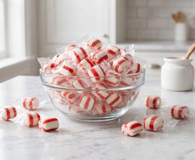 DM Sweets Peppermint Puffs with red-white swirl, ideal for festive bowls.
