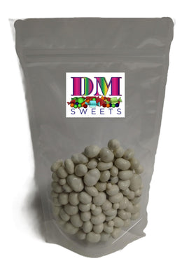 DM Sweets Yogurt Coated Cranberries in a hand, ready as a quick snack