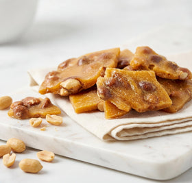 DM Sweets Peanut Brittle in a gift basket display