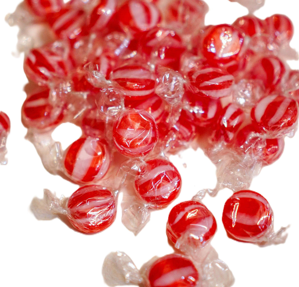 DM Sweets cinnamon discs close-up, crisp texture and bold color.