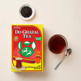 Do Ghazal tea brewing in teapot with steam hints at flavor.