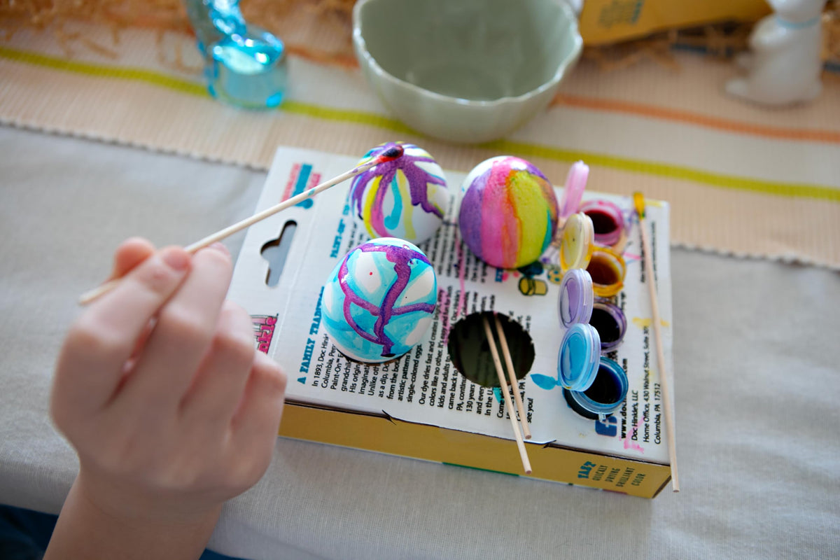 Doc Hinkle Paint-On Dye bottle with set of four colors on desk.