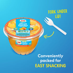 Dole diced peaches close-up showing bite-sized pieces in juice