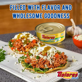 Dolores open can with flaky texture close-up for salads or casseroles.