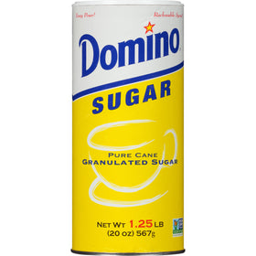 Domino granulated sugar canister pour spout demonstrates mess-free measuring for recipes.