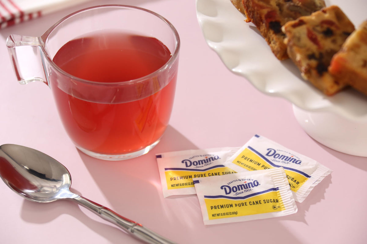 Close-up of Domino sugar packets highlighting neat single-serve portions.