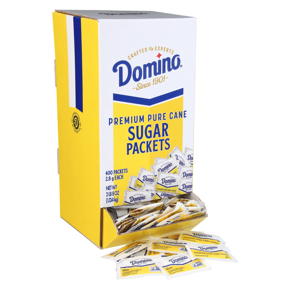 Domino sugar packets in a dispenser box for quick, mess-free service in busy environments.