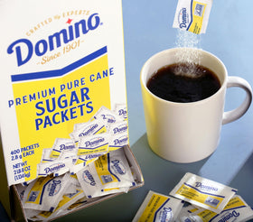 Domino sugar packets, single-serve two-point-eight-gram, ideal for cafes and offices.