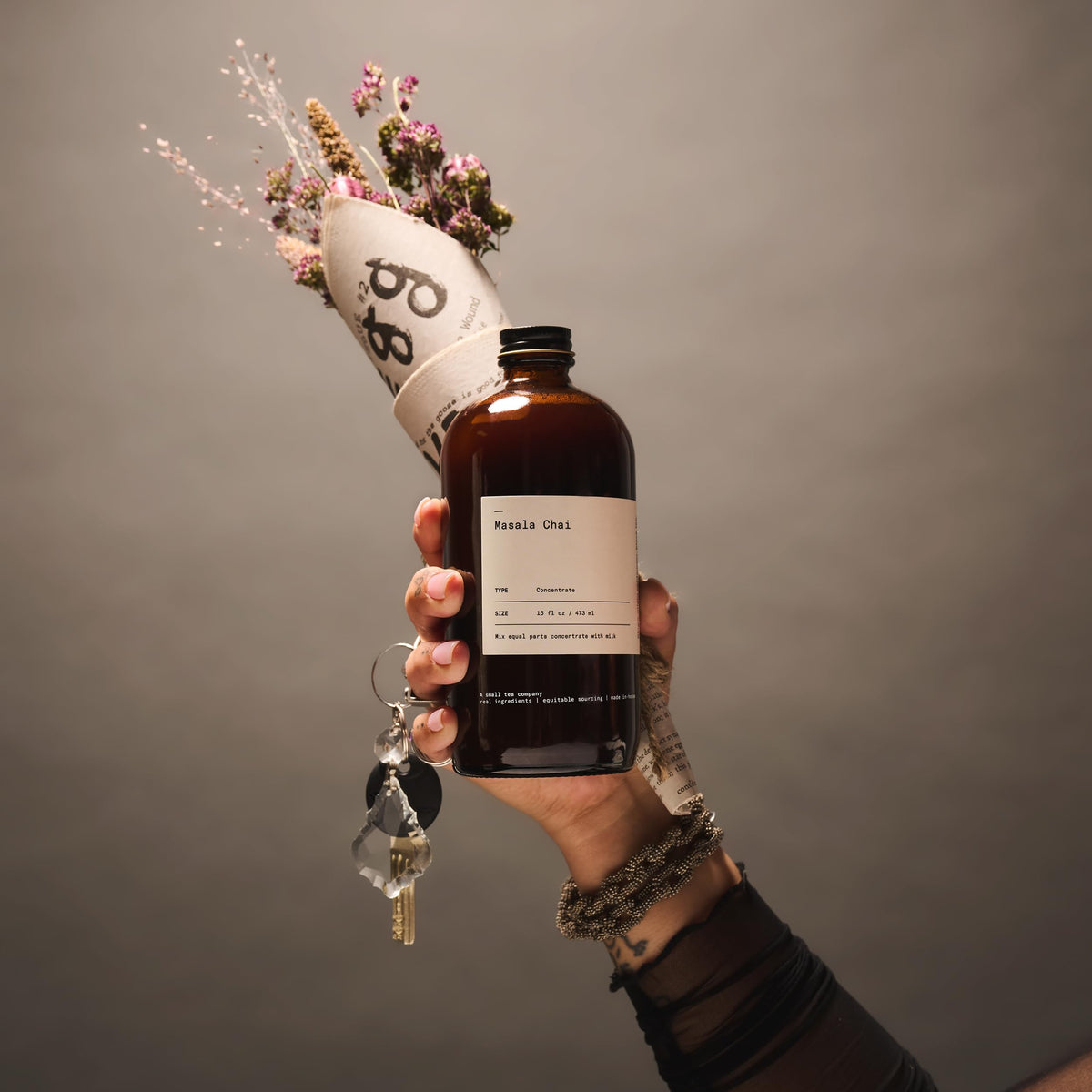 Pour Dona Masala Chai concentrate from bottle for iced drinks