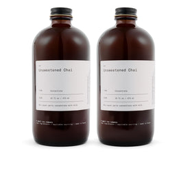 DONA unsweetened chai concentrate bottle for bold, customizable beverages.