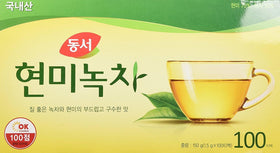 Dongsuh Korean Brown Rice Green Tea dry bags closeup highlighting natural ingredients.