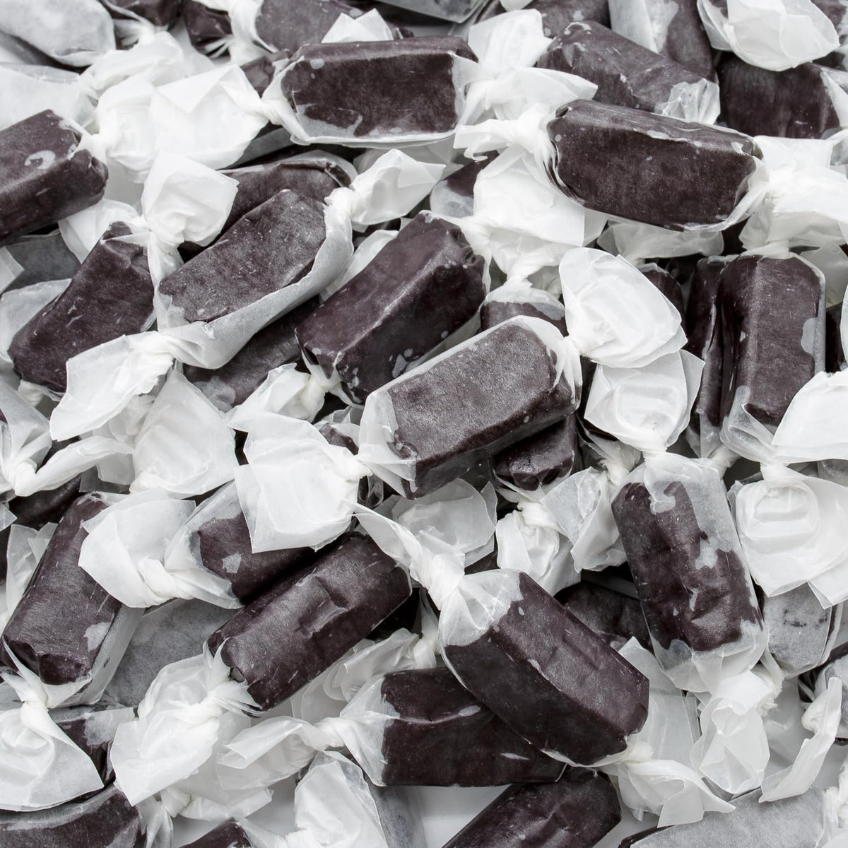 Donty-Tonty black licorice caramel piece close-up, smooth texture ideal for snacking.