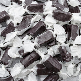 Donty-Tonty black licorice caramel piece close-up, smooth texture ideal for snacking.