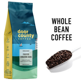Door County Coffee Frosted Cinnamon Buns cup releasing inviting cinnamon aroma for cozy sips.