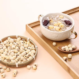 Doorpetal lotus seeds simmering in a pot for tender congee.