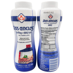 Dos Anclas Sal Parrillera shaker pouring salt for even rib seasoning.