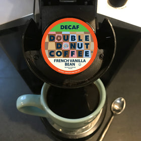 Office break room with Double Donut decaf French Vanilla coffee for convenient refreshment.