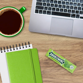 Doublemint blue-green gum sticks closeup, crisp mint taste for daily freshness.