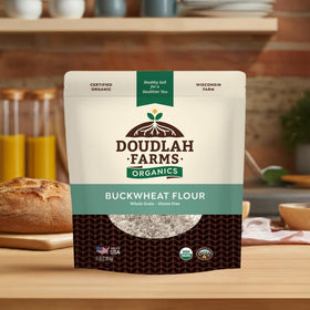 Measuring cup beside Doudlah Farms buckwheat flour for cooking
