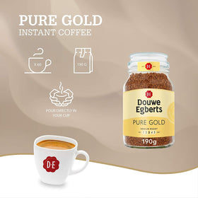 Pour Douwe Egberts Pure Gold into a mug for smooth instant coffee.