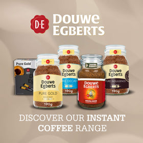 Douwe Egberts Pure Indulgence labeled jar spoon-ready contents invites quick rituals.