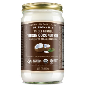 Dr. Bronner's Organic Virgin Coconut Oil bottle with whole kernels, ideal for cooking and body care.
