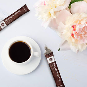 Pouring hot coffee into a mug reveals rich, smooth flavor.
