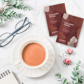 Dr. Kellyann mug pouring hot cocoa for a comforting, smooth drink experience