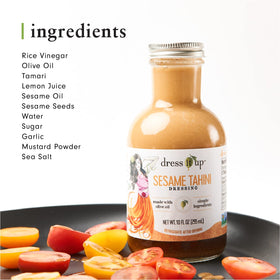 Dress It Up dressing poured over a bright salad for creamy sesame flavor.