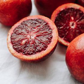Drink Botanicals Ireland blood orange slices cocktail glass accent with fresh zest