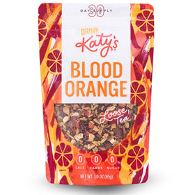 DRINK KATY'S Blood Orange loose tea pour showcases bright citrus aroma for a refreshing cup.